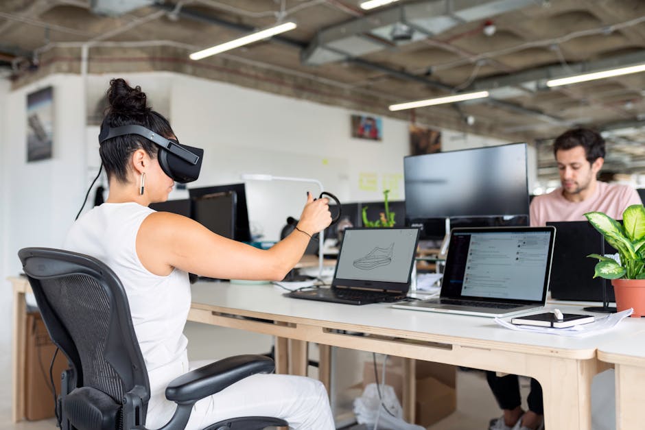 Woman using virtual reality headset in a modern office for design and innovation